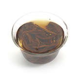 Translucent and smooth honey-gold tea soup from the Da Xue Shan high-mountain region.
