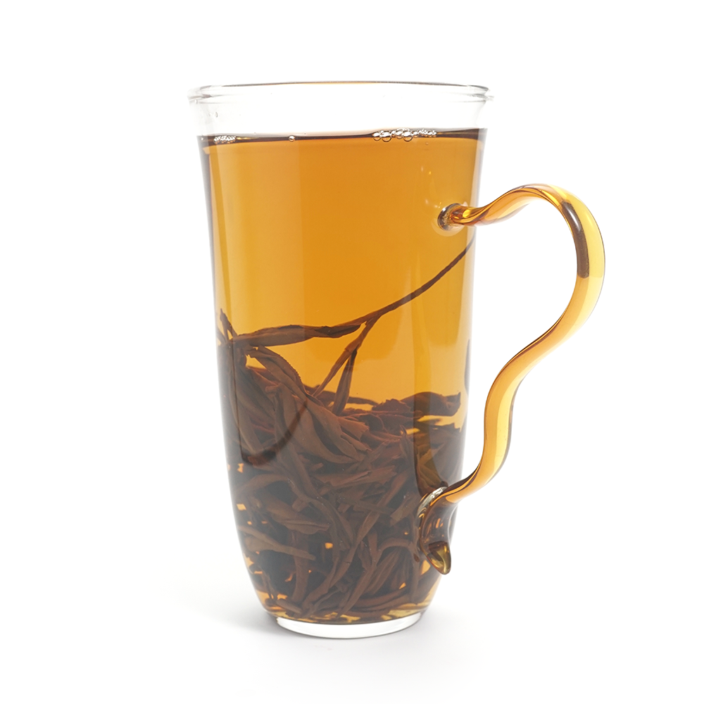A bright amber tea liquor of Honey Yunnan Black Tea (Da Xue Shan) with high clarity.
