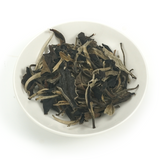 Premium 2015 Sweet Plum-Scented Aged White Tea dry leaves with natural 9-year vintage transformation.