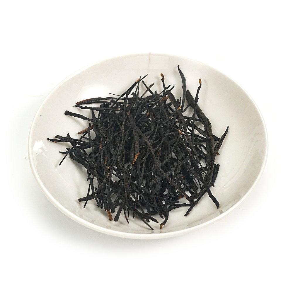 Aromatic black tea dry leaves with elegant golden tips