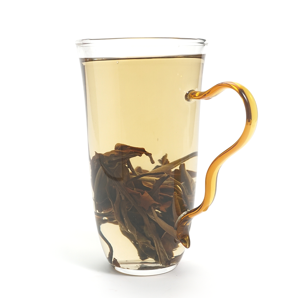 Bright apricot-yellow tea liquor of 2024 Sweet Plum-Scented Yunnan White Tea with high clarity.