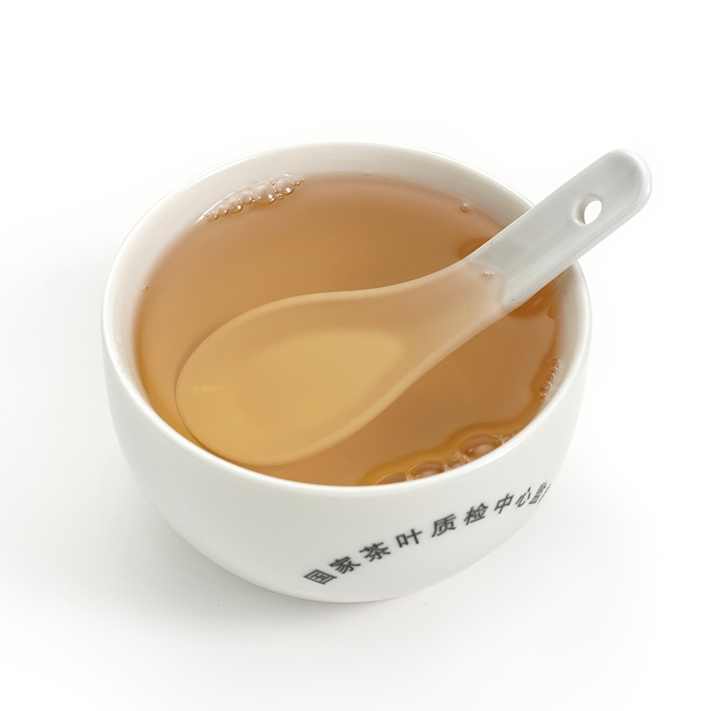 2024 Ma’anshan raw Pu’er tea liquor, floral orchid aroma bright golden infusion