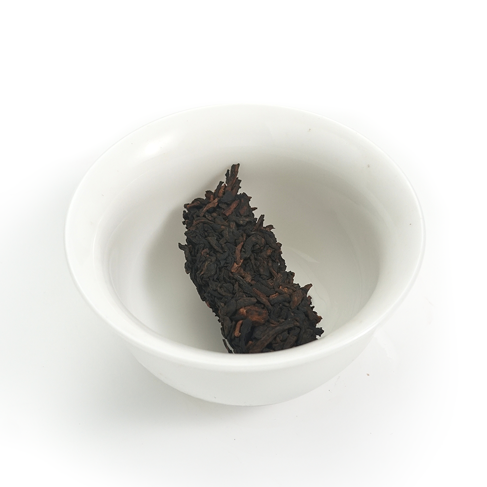 Ripe Pu’er dry leaves 357g, 2019 aged compressed tea material