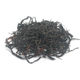 Fruity Dianhong Black Tea (Black Beauty) dry leaves with prominent golden tips and dark luster.