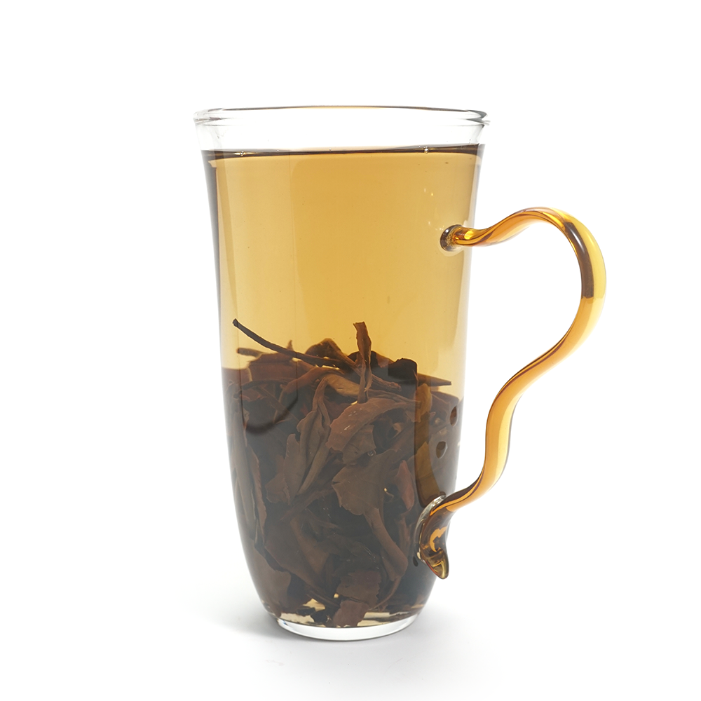 Bright amber-gold tea liquor of 2015 Sweet Plum-Scented Aged White Tea showing rich clarity.