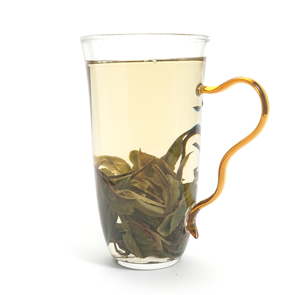 Bright apricot-yellow tea liquor of 2025 Herbal-Woody Shou Mei White Tea with high clarity.